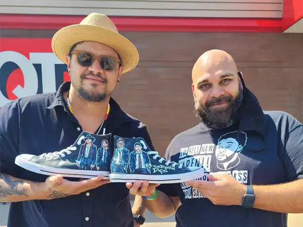 Chris Thompson of Semurai Designs gifting custom Reservation Dogs shoes to creator Sterlin Harjo